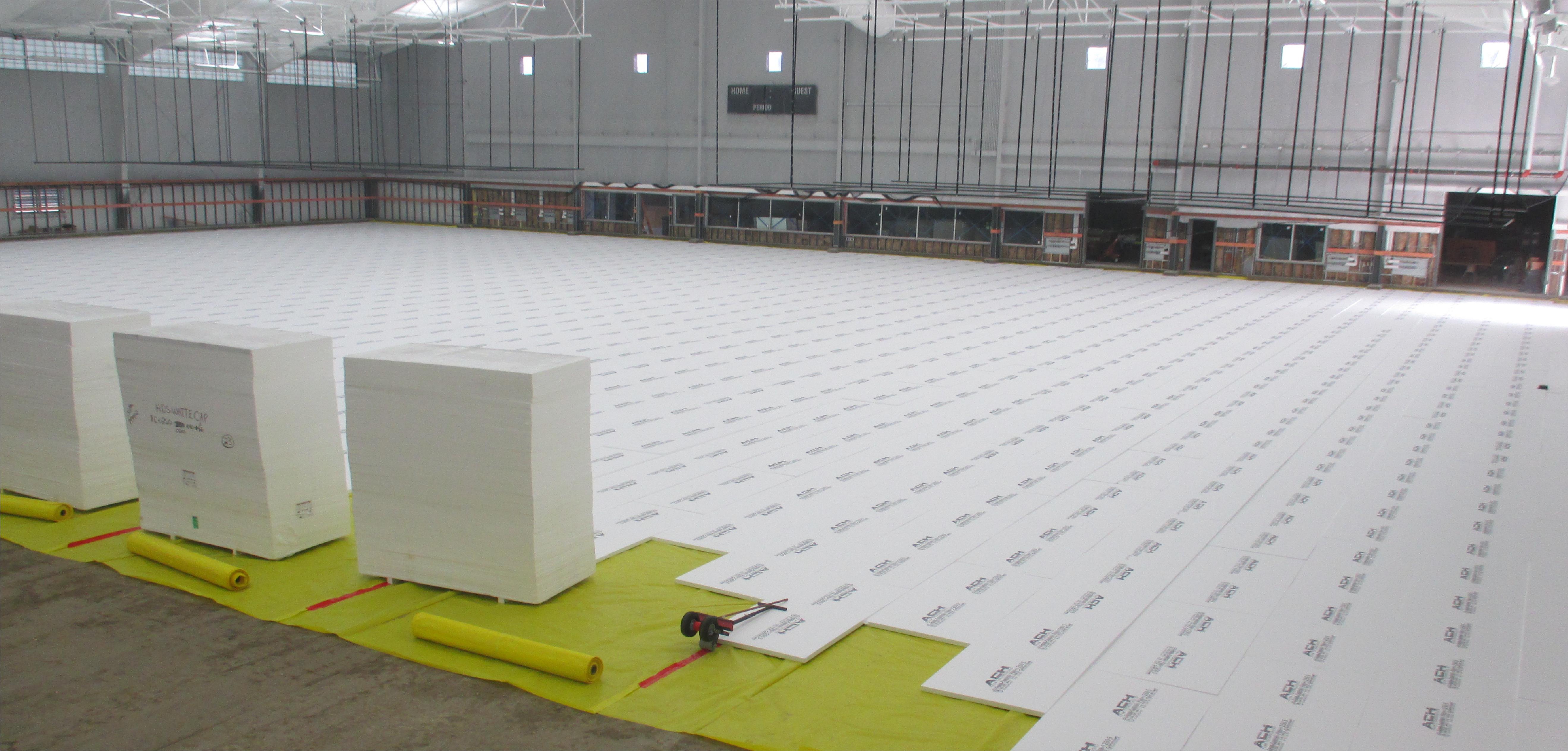 Below-grade insulation boards laid out in a warehouse.