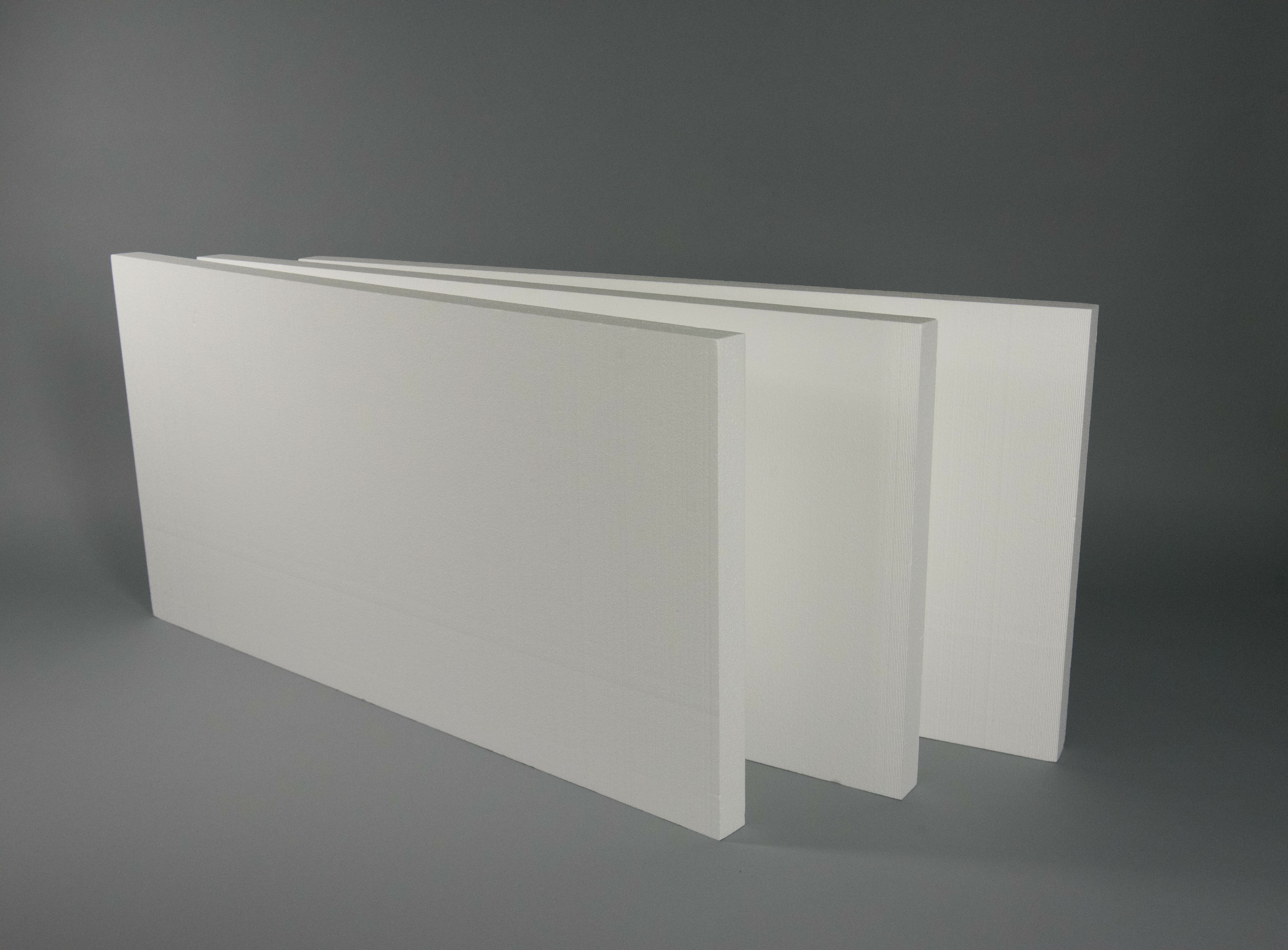 Close up image of white Atlas ThermalStar Rigid Insulation against a grey backdrop.