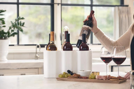 Wine bottles packed in insulated wine shipping packaging for safe delivery to a home.