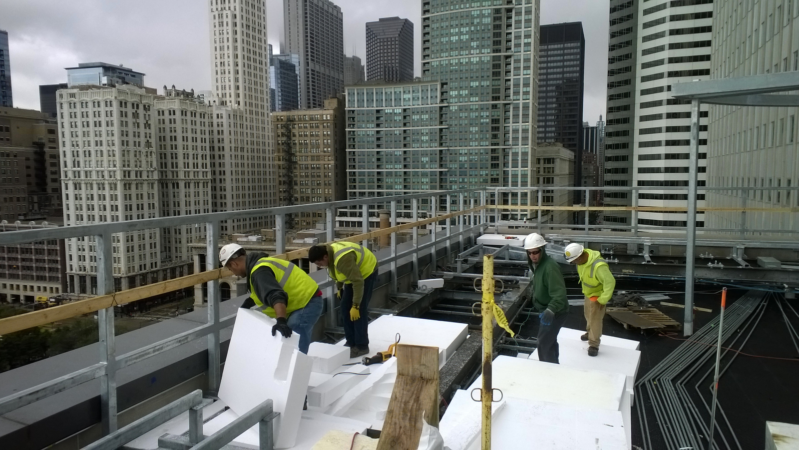 Crew installing Atlas Geofoam for a green roof application in Chicago